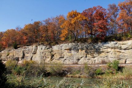 Rock wall and trees above canal