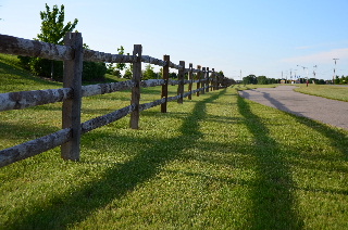 Wooden fence and shadow near Volo City Hall