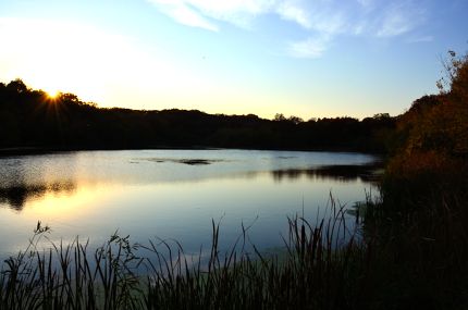 Sunset over lake with autumn colors